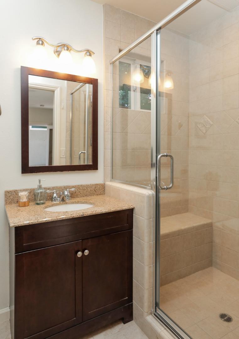1202 Payne Drive Los Altos, CA 94024 - Photo 32 of 36 a bathroom with a bathtub a sink and a mirror