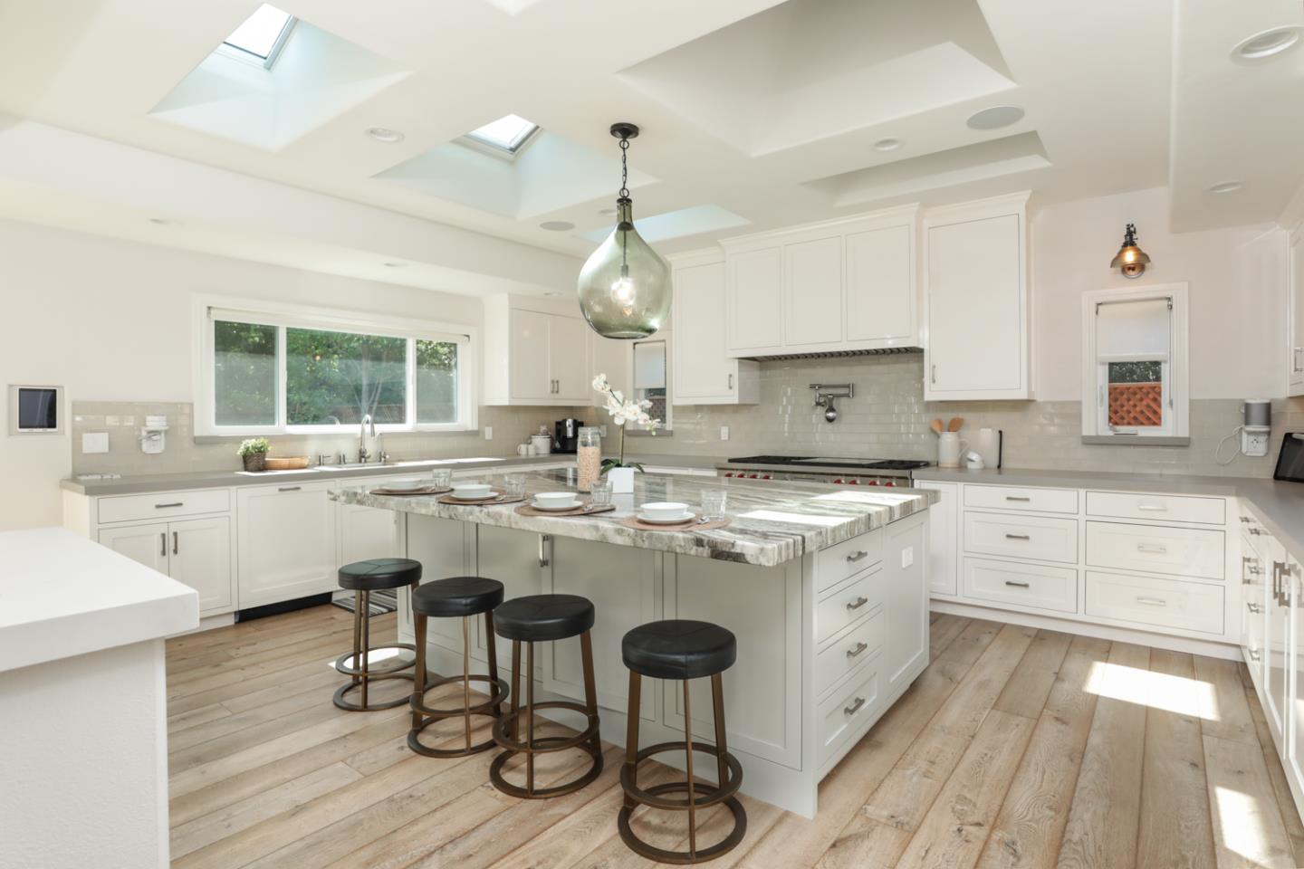 1202 Payne Drive Los Altos, CA 94024 - Photo 6 of 36 a kitchen with center island and white cabinets