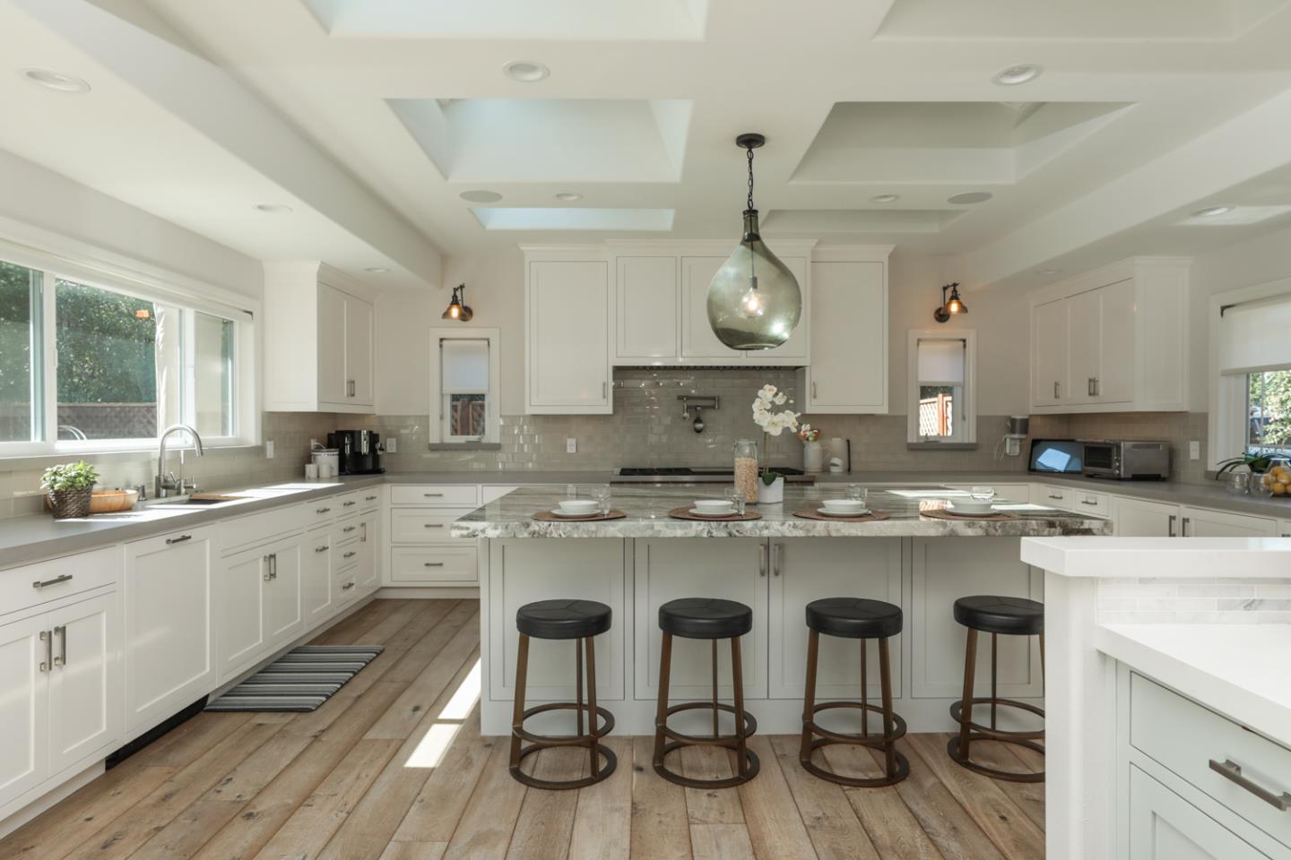 1202 Payne Drive Los Altos, CA 94024 - Photo 7 of 36 a kitchen with white cabinets and chairs