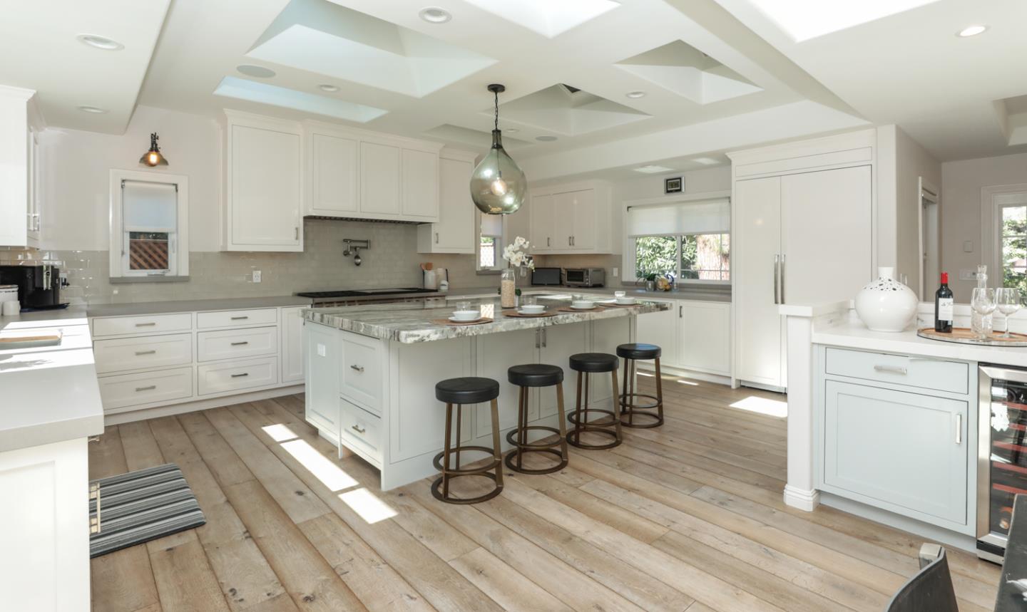 1202 Payne Drive Los Altos, CA 94024 - Photo 8 of 36 a kitchen with granite countertop a sink cabinets and wooden floor