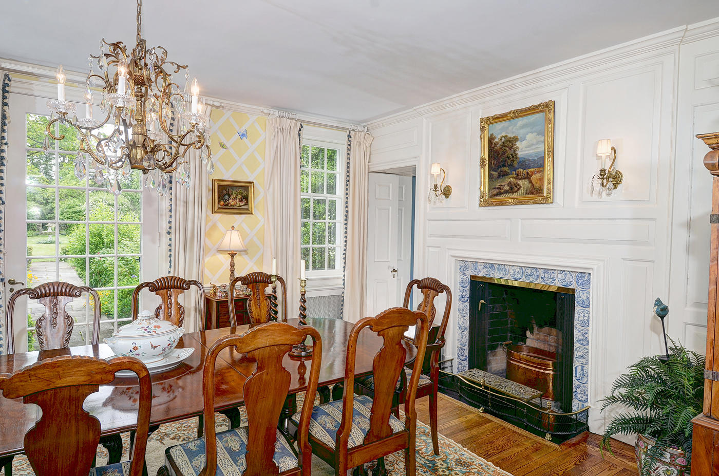 96 Woods End Road New Canaan, CT 06840 - Photo 11 of 21 a dining room with furniture a fireplace and large windows