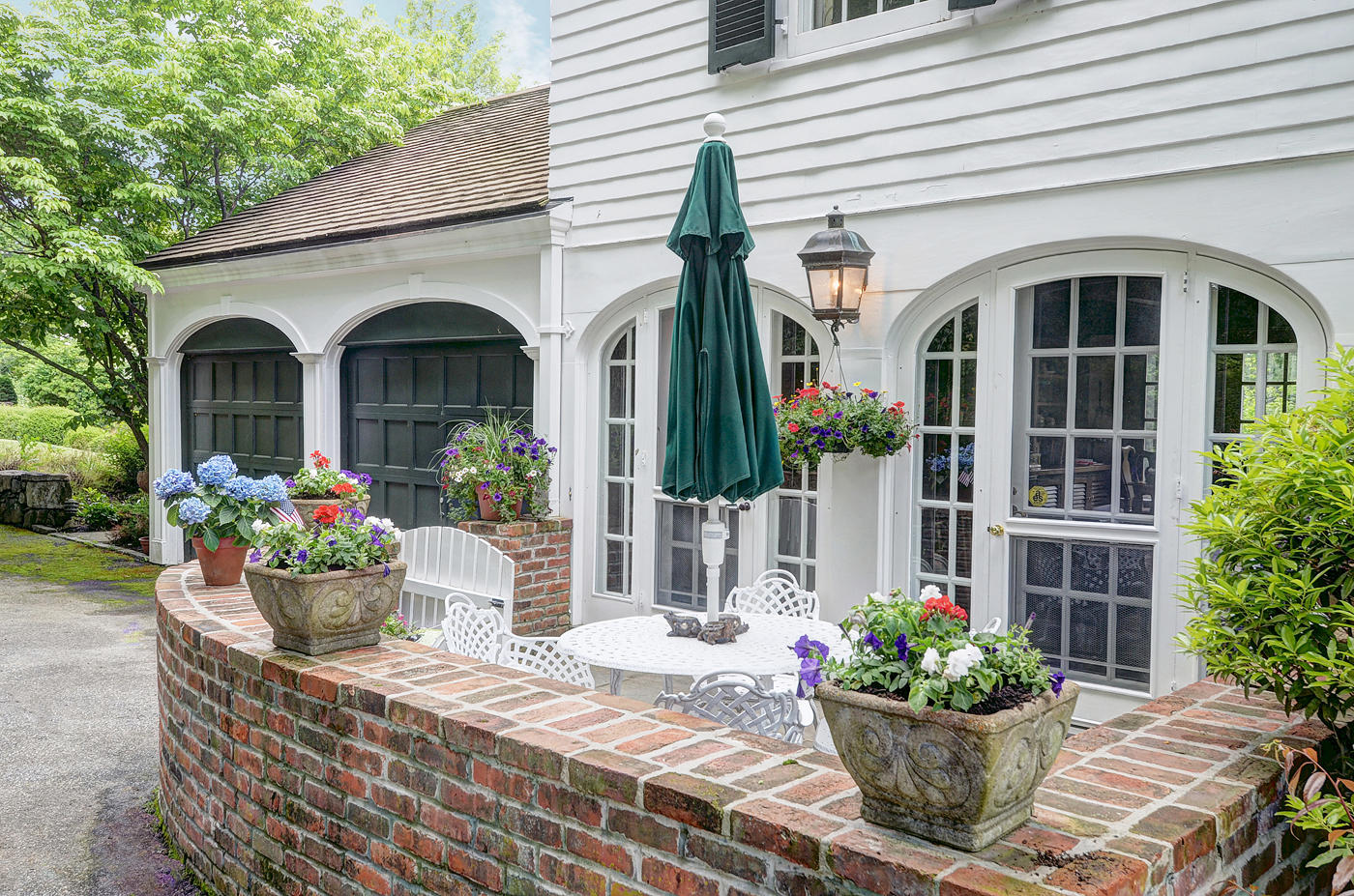 96 Woods End Road New Canaan, CT 06840 - Photo 14 of 21 a front view of a house with a porch