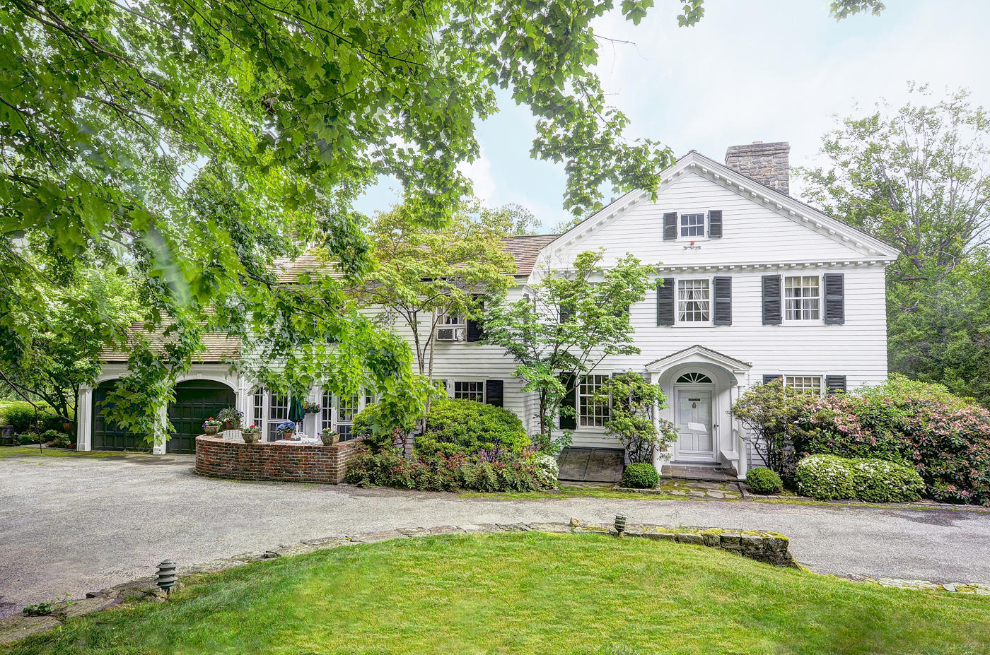 96 Woods End Road New Canaan, CT 06840 - Photo 15 of 21 a house view with a garden space