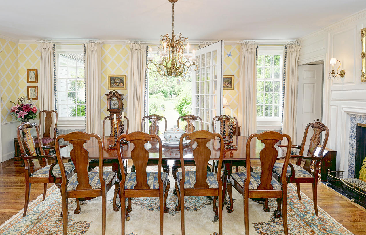 96 Woods End Road New Canaan, CT 06840 - Photo 10 of 21 a view of a dining room with furniture and windows