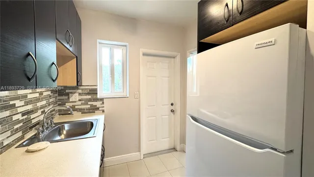 a bathroom with a sink and a washing machine