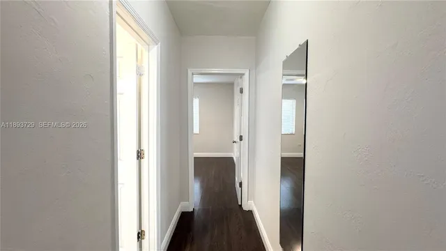 a view of a bathroom from a hallway