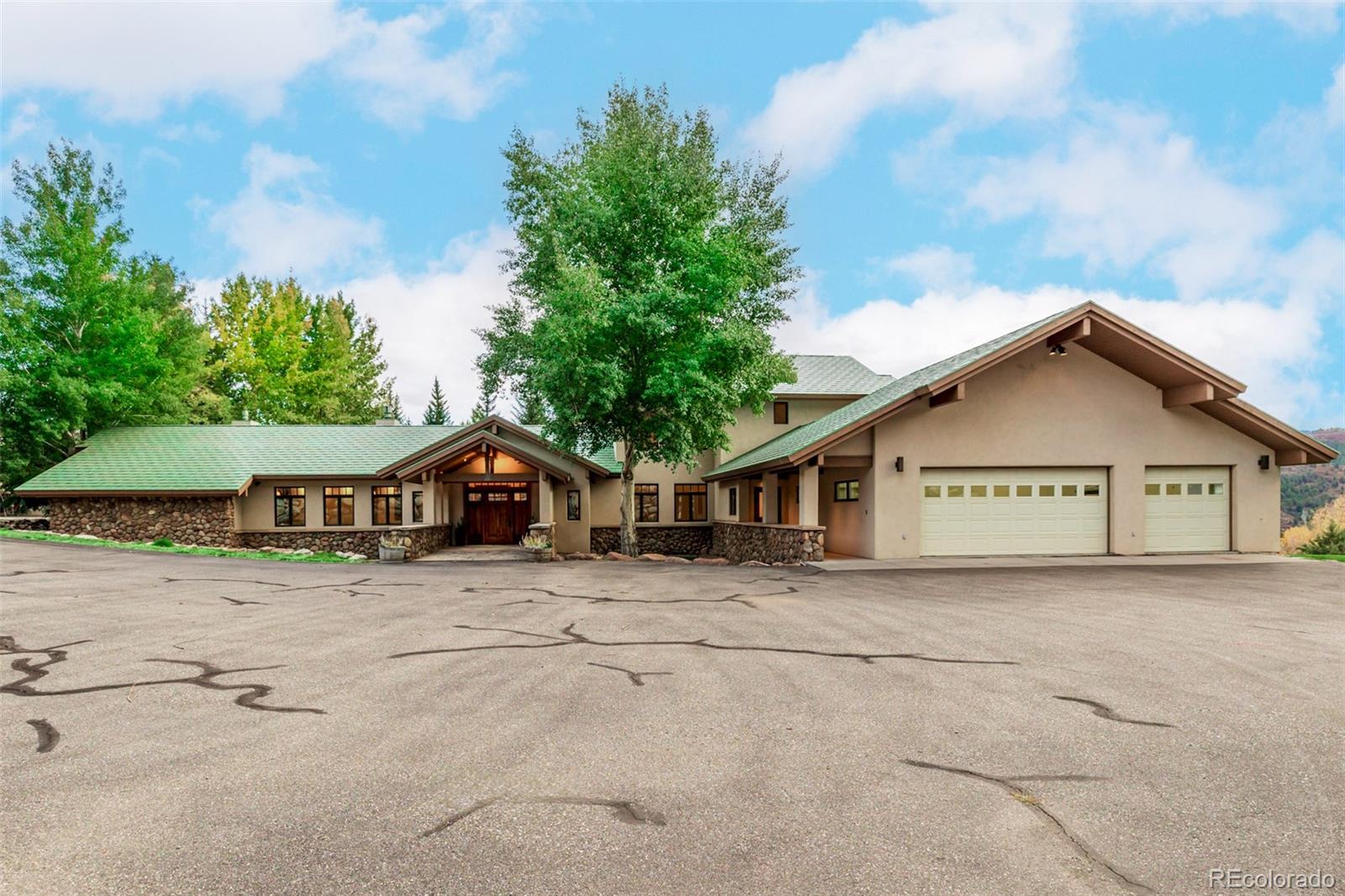 983 Beard Creek Road Edwards, CO 81632 - Photo 17 of 23 a view of a house with a yard and large trees
