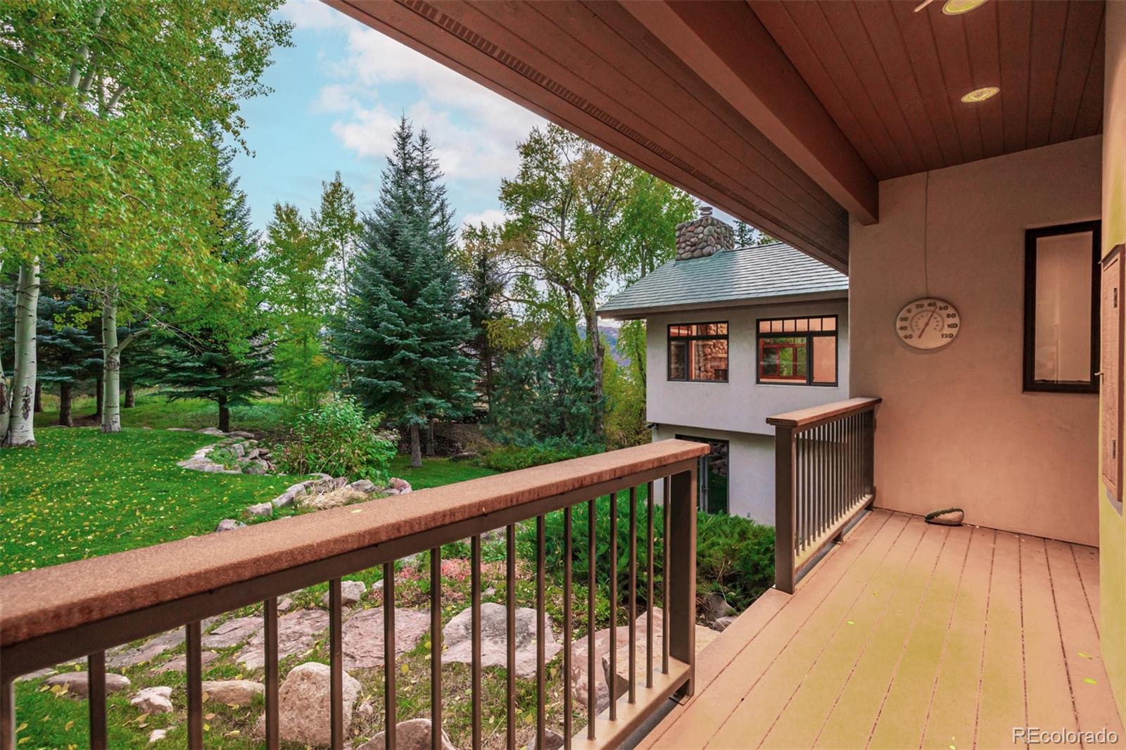 983 Beard Creek Road Edwards, CO 81632 - Photo 21 of 23 a balcony with wooden floor and outdoor seating