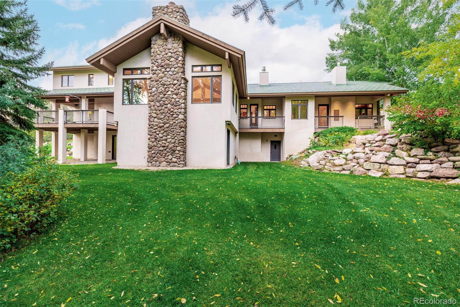 983 Beard Creek Road Edwards, CO 81632 - Photo 3 of 23 a front view of a house with garden