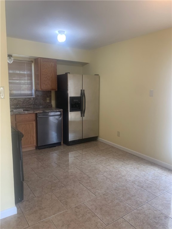 2829 South Sea Drive Corpus Christi, TX 78418 - Photo 3 of 10 a view of a kitchen with a sink and refrigerator