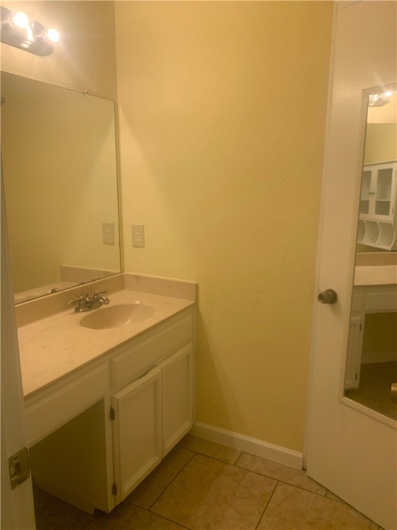2829 South Sea Drive Corpus Christi, TX 78418 - Photo 7 of 10 a bathroom with a sink and a mirror