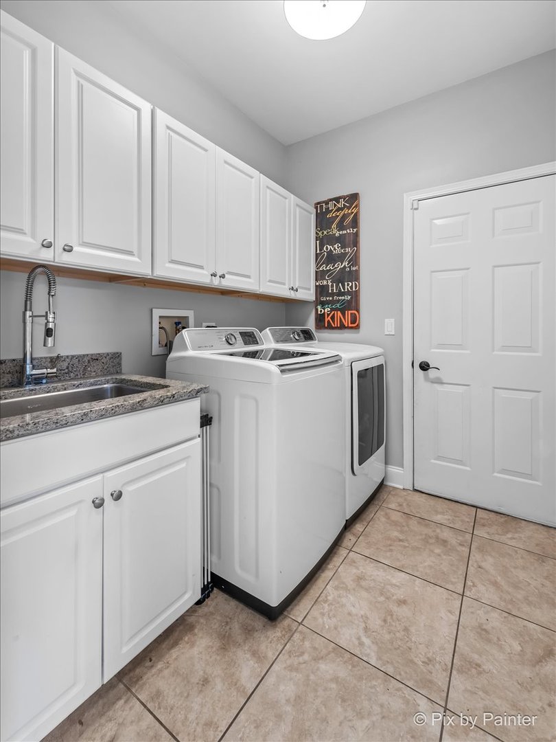 2 Shadow Creek Court Lake In The Hills, IL 60156 - Photo 18 of 44 a kitchen with cabinets and white appliances