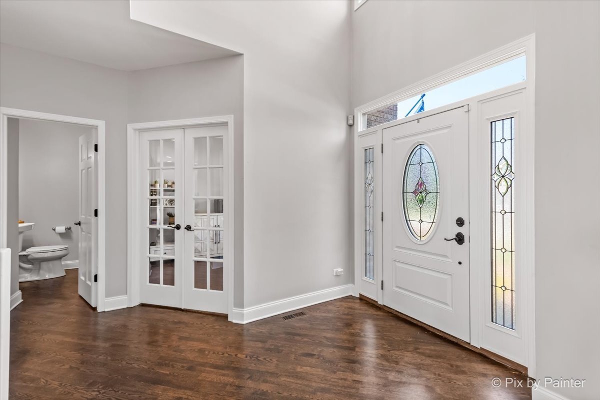 2 Shadow Creek Court Lake In The Hills, IL 60156 - Photo 2 of 44 an empty room with wooden floor and windows