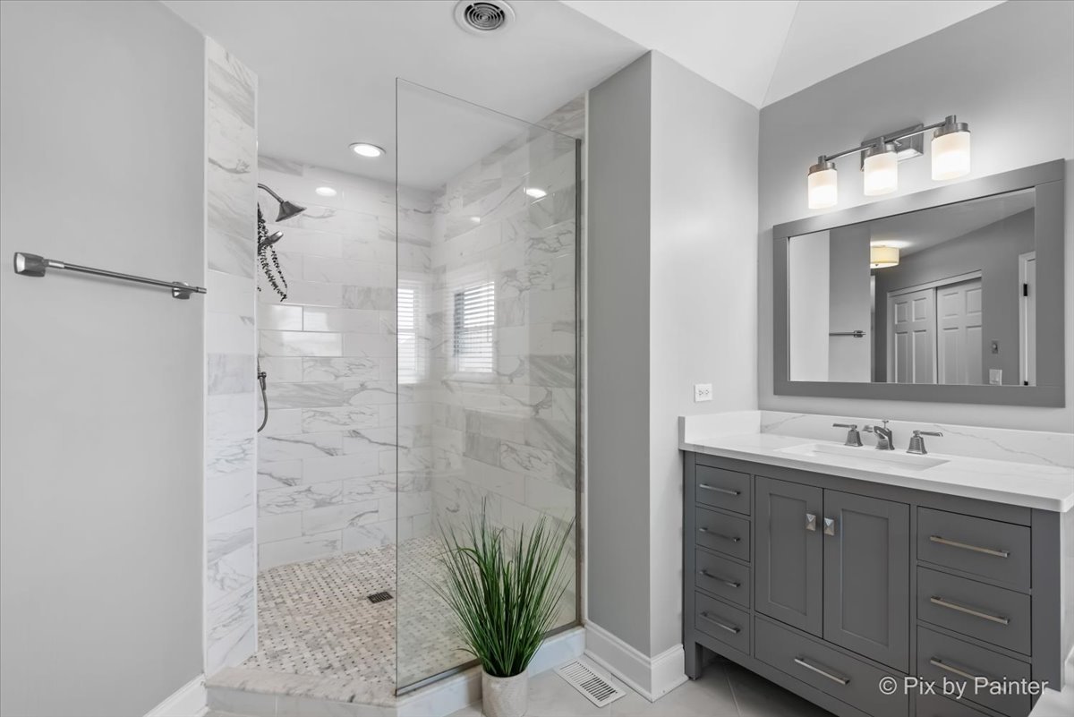2 Shadow Creek Court Lake In The Hills, IL 60156 - Photo 21 of 44 a bathroom with a double vanity sink mirror and shower