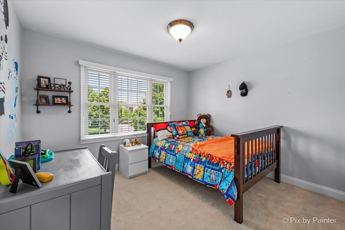 2 Shadow Creek Court Lake In The Hills, IL 60156 - Photo 23 of 44 a bedroom with a bed and a window