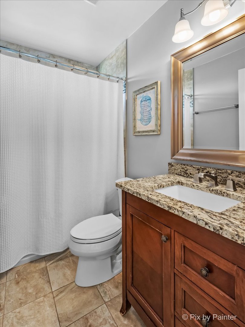 2 Shadow Creek Court Lake In The Hills, IL 60156 - Photo 25 of 44 a bathroom with a granite countertop sink toilet and a mirror