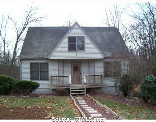 9 Lookout Hill Road Old Saybrook, CT 06475 - Photo 1 of 1 a front view of a house with garden