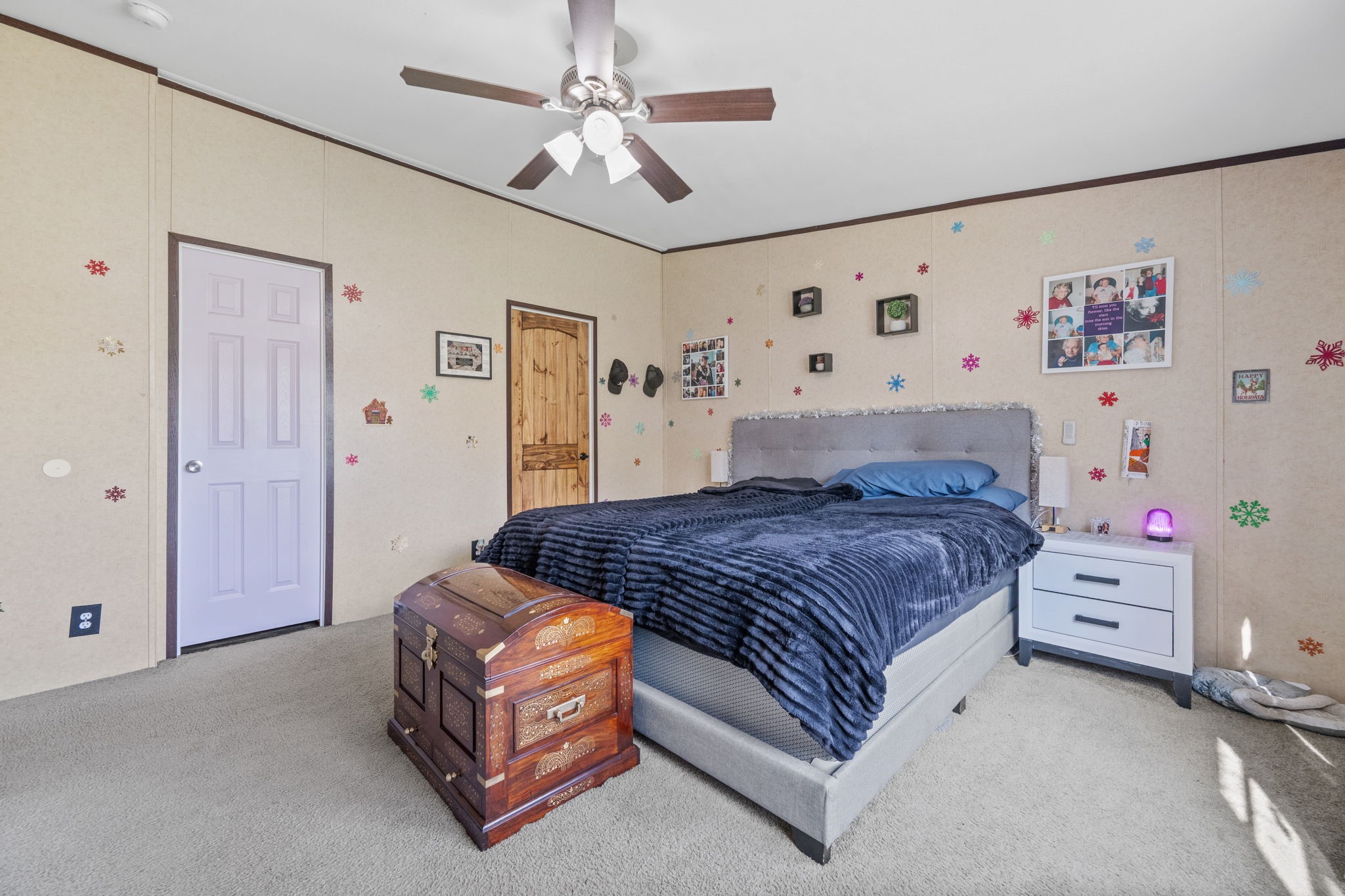 440 River Road Goodrich, TX 77335 - Photo 12 of 18 a bedroom with a bed and a chandelier