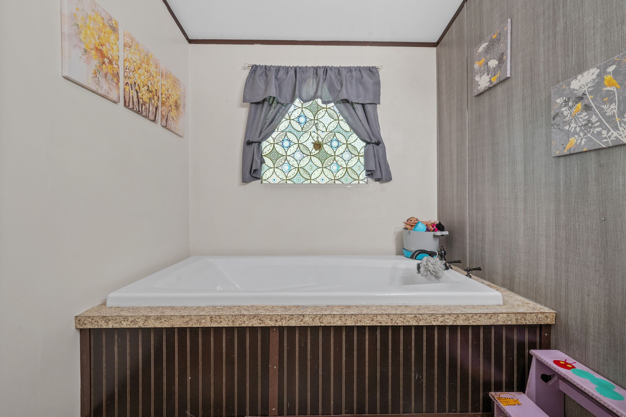 440 River Road Goodrich, TX 77335 - Photo 14 of 18 a bathroom with a granite countertop sink and a shower curtain