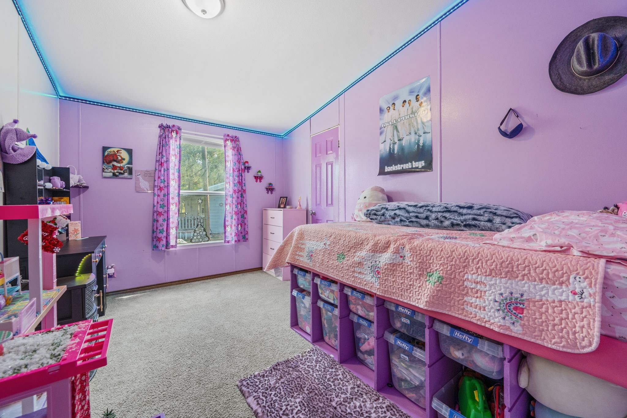 440 River Road Goodrich, TX 77335 - Photo 16 of 18 a bedroom with a bed a dresser and a window