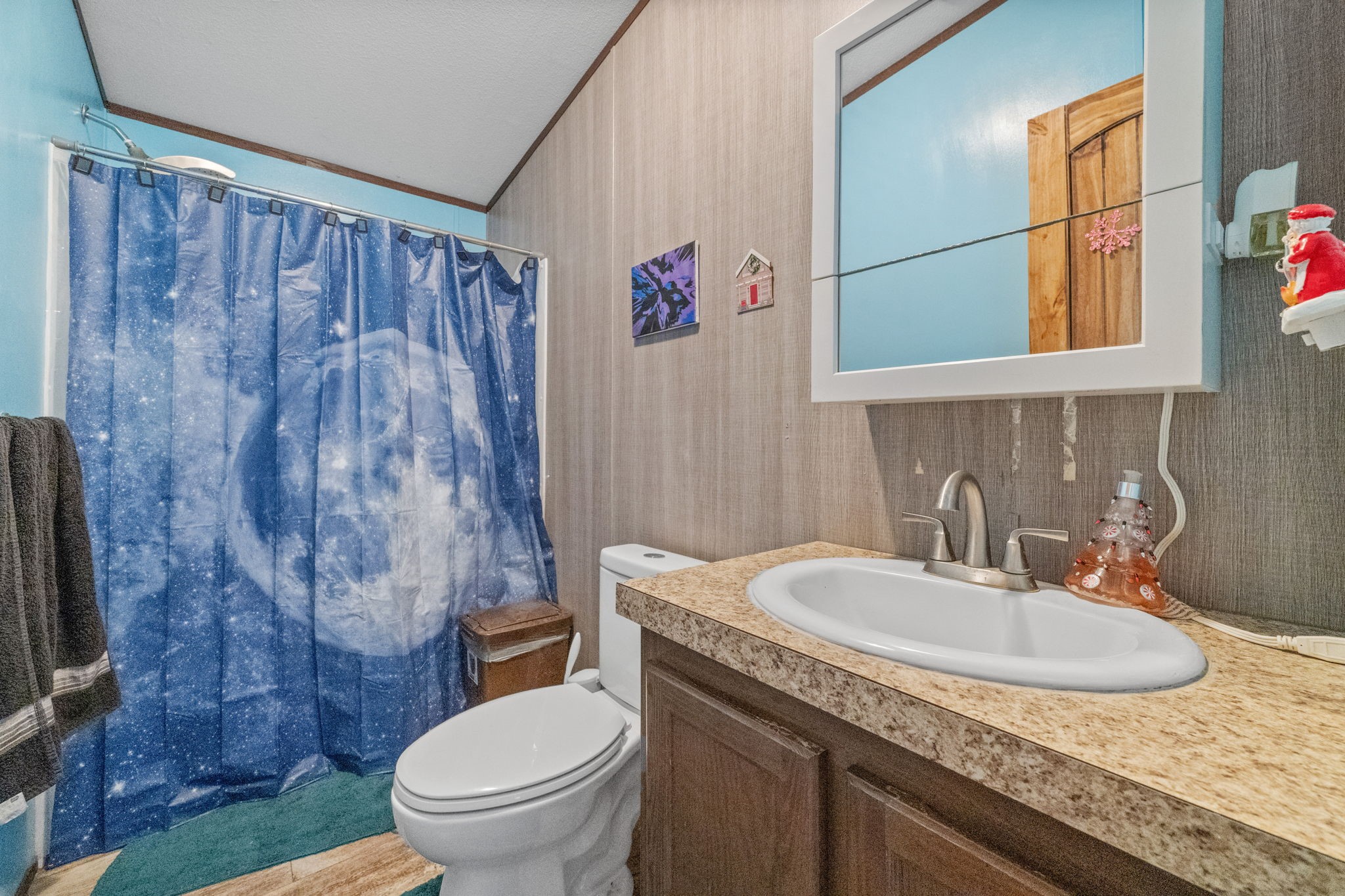 440 River Road Goodrich, TX 77335 - Photo 17 of 18 a bathroom with a granite countertop sink and a mirror