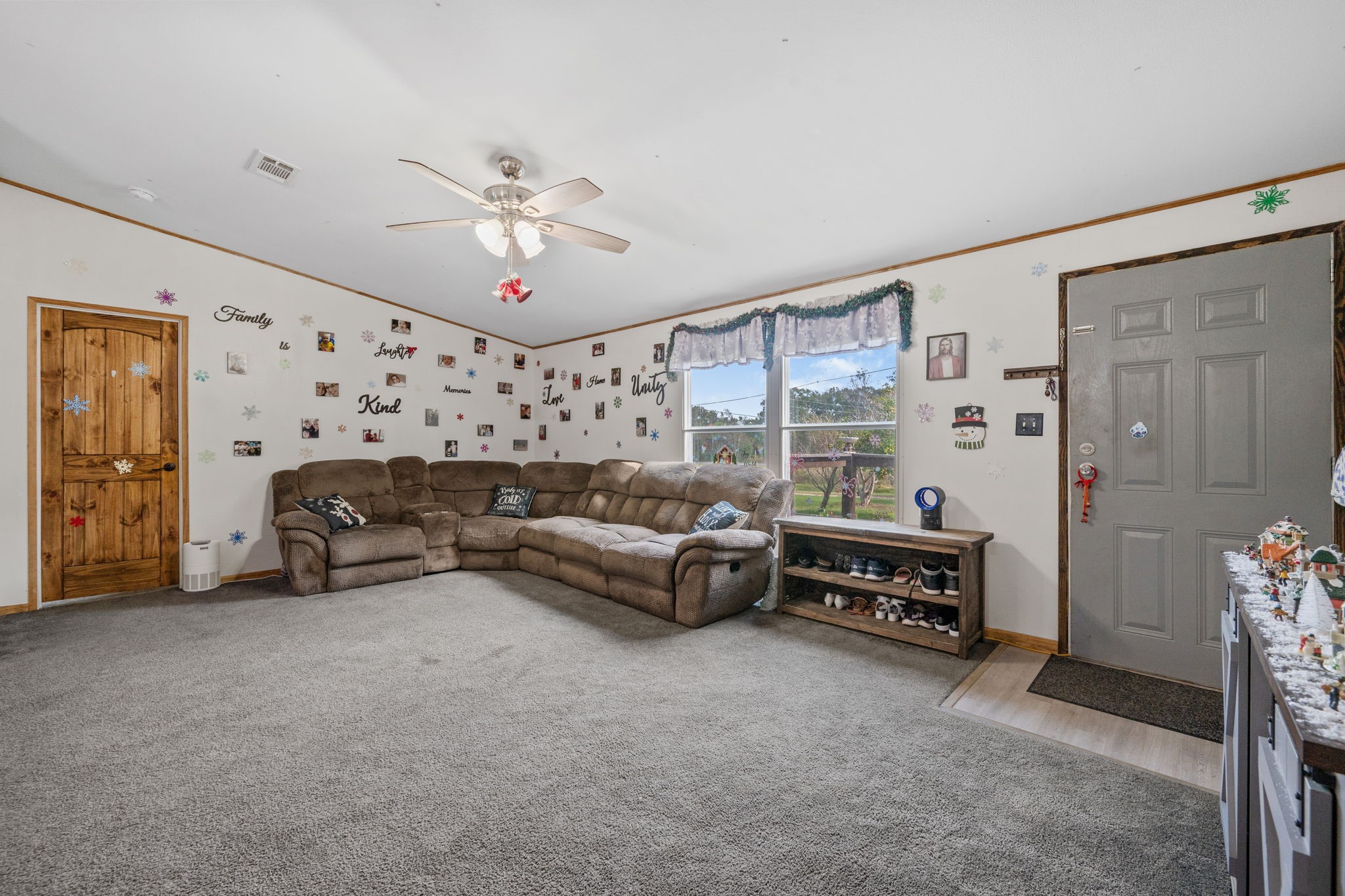 440 River Road Goodrich, TX 77335 - Photo 4 of 18 a living room with furniture and a chandelier
