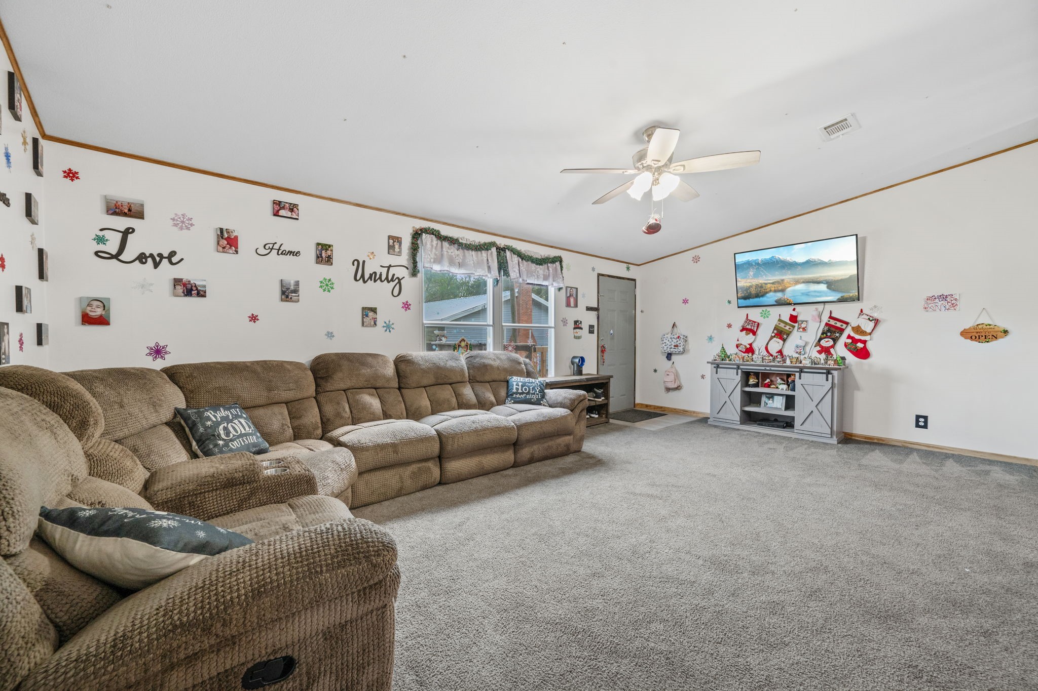 440 River Road Goodrich, TX 77335 - Photo 5 of 18 a living room with furniture and a chandelier