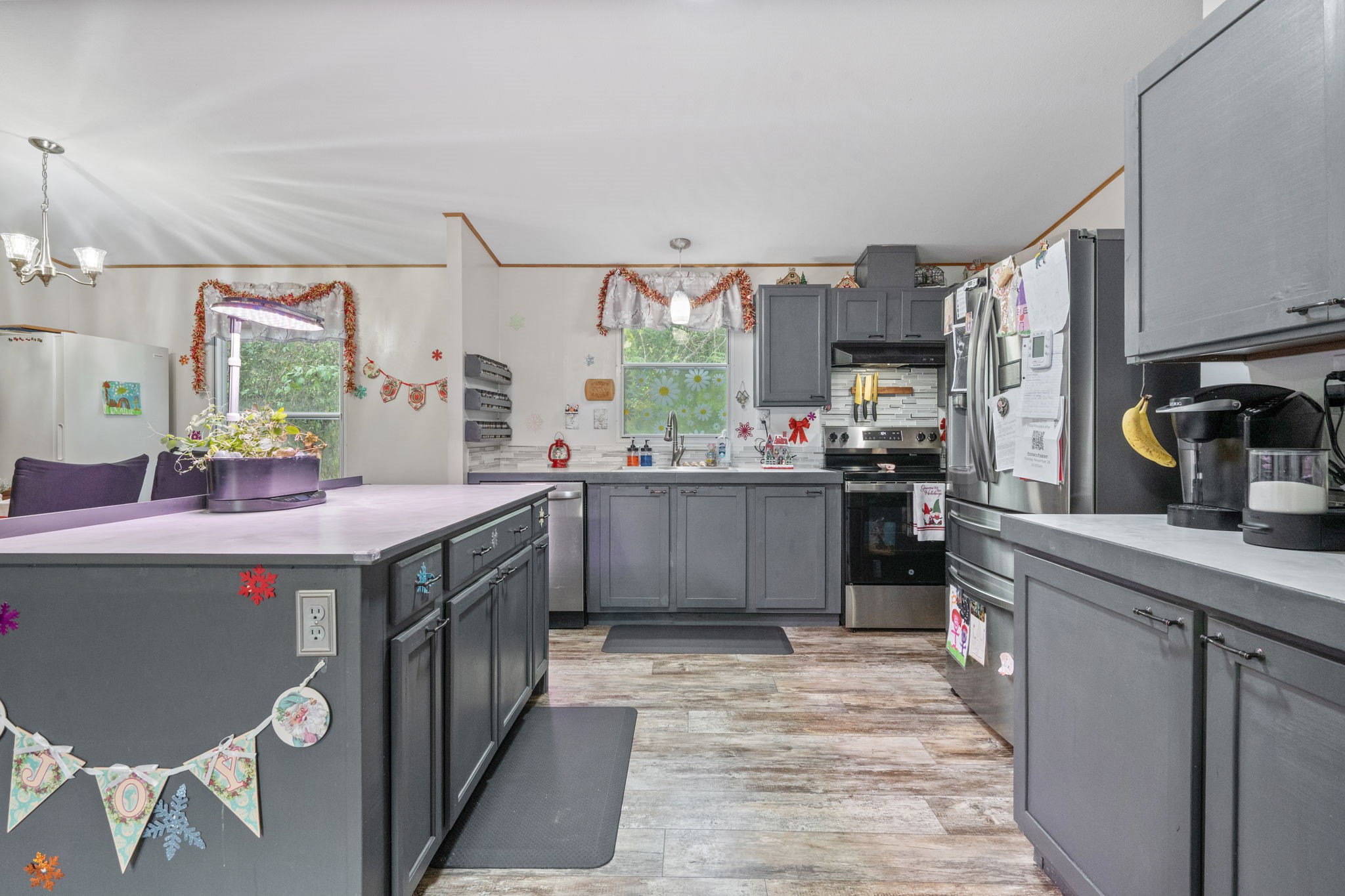 440 River Road Goodrich, TX 77335 - Photo 8 of 18 a kitchen with a sink stove and cabinets