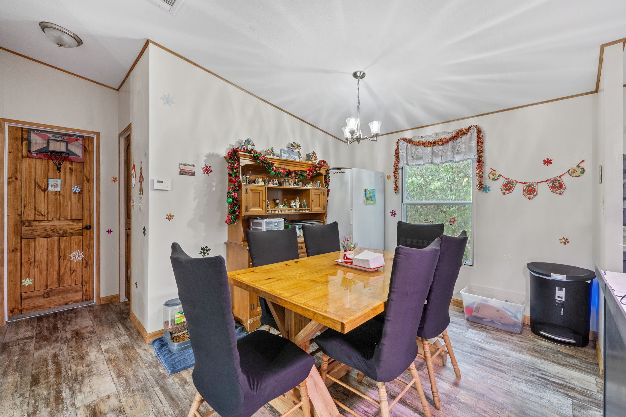 440 River Road Goodrich, TX 77335 - Photo 10 of 18 a view of a dining room with furniture window and wooden floor