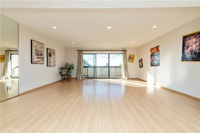 a kitchen with stainless steel appliances white cabinets and a microwave oven