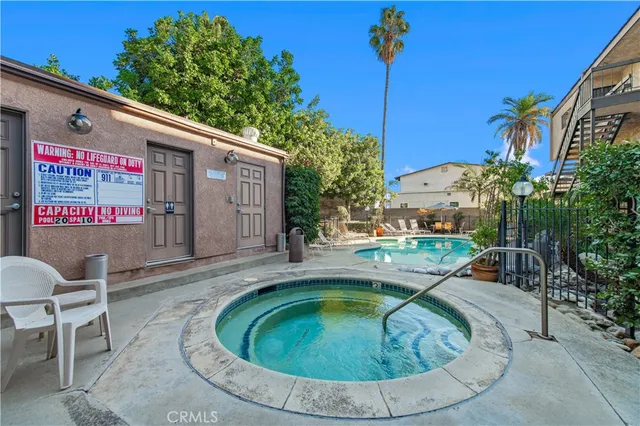 a view of a swimming pool with a patio