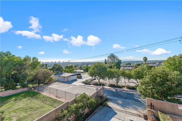 an aerial view of a house with swimming pool and glass doors