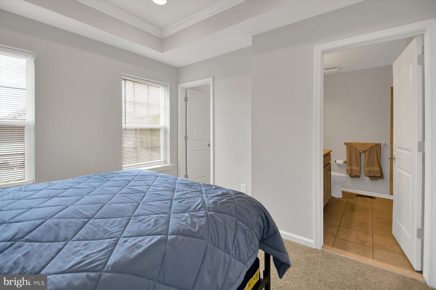3600 Jacob Stout Road, Unit 3 Doylestown, PA 18902 - Photo 22 of 33 a bedroom with a bed and a view of bathroom