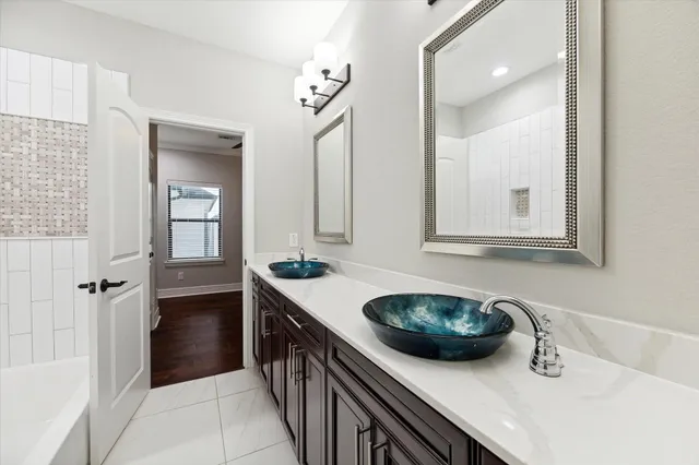 a bathroom with a sink a vanity and a mirror