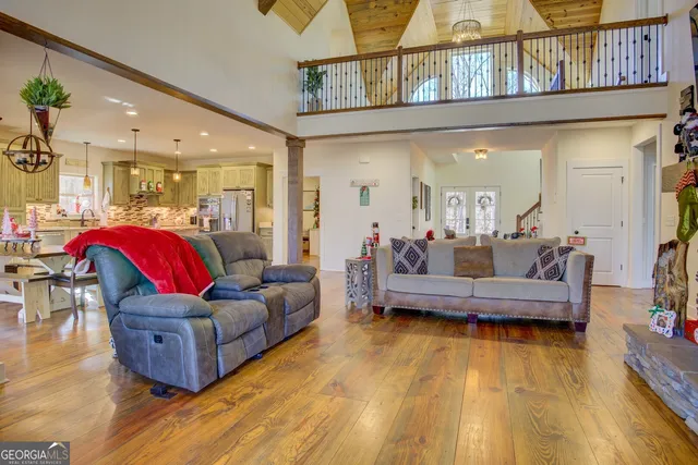 a kitchen with stainless steel appliances granite countertop a refrigerator sink and stove