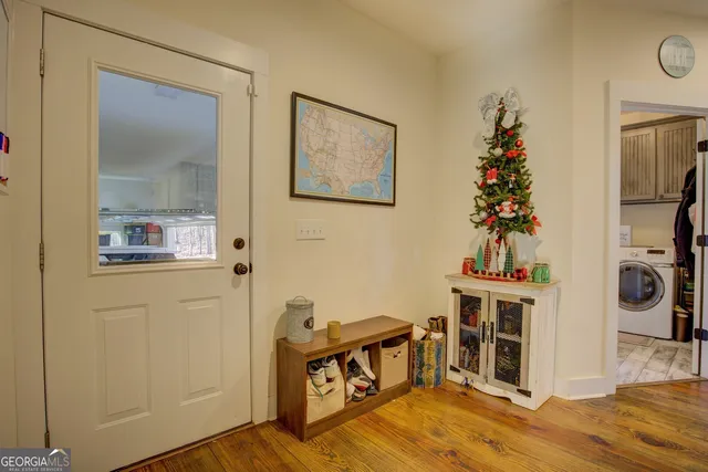 a view of a porch with wooden floor and iron stairs