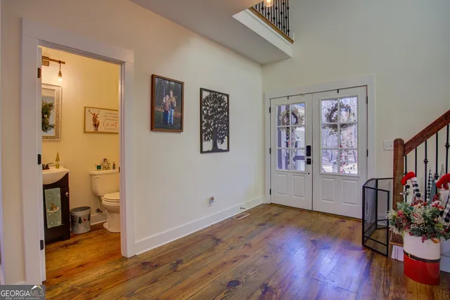 a view of hall way with furniture and windows
