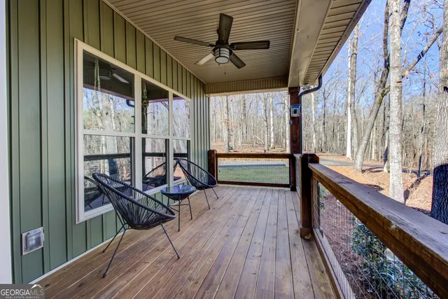 a front view of a house with a yard covered in snow