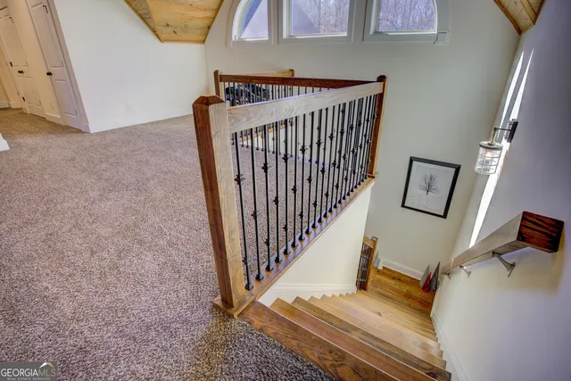 a view of a house with a yard covered with snow