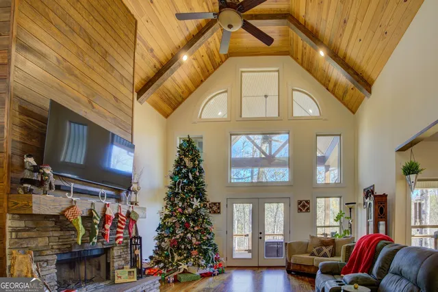 a kitchen with stainless steel appliances granite countertop a sink a stove and a wooden floors