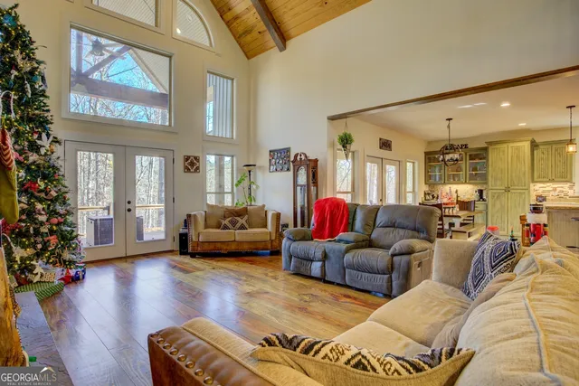 a kitchen with stainless steel appliances granite countertop a sink a stove and a refrigerator