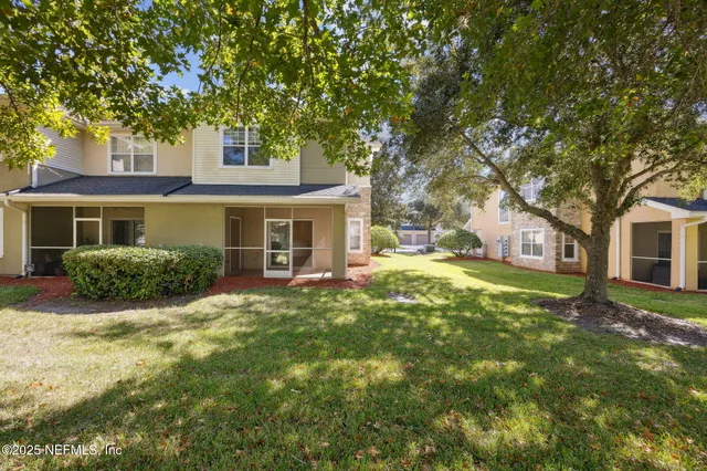 a wooden bench sitting in front of a building