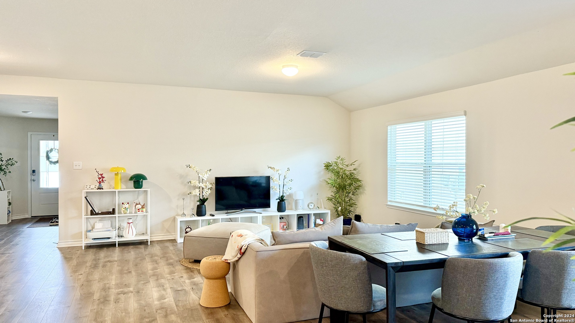 13535 Boothe Grove San Antonio, TX 78254 - Photo 2 of 7 a living room with furniture and a flat screen tv