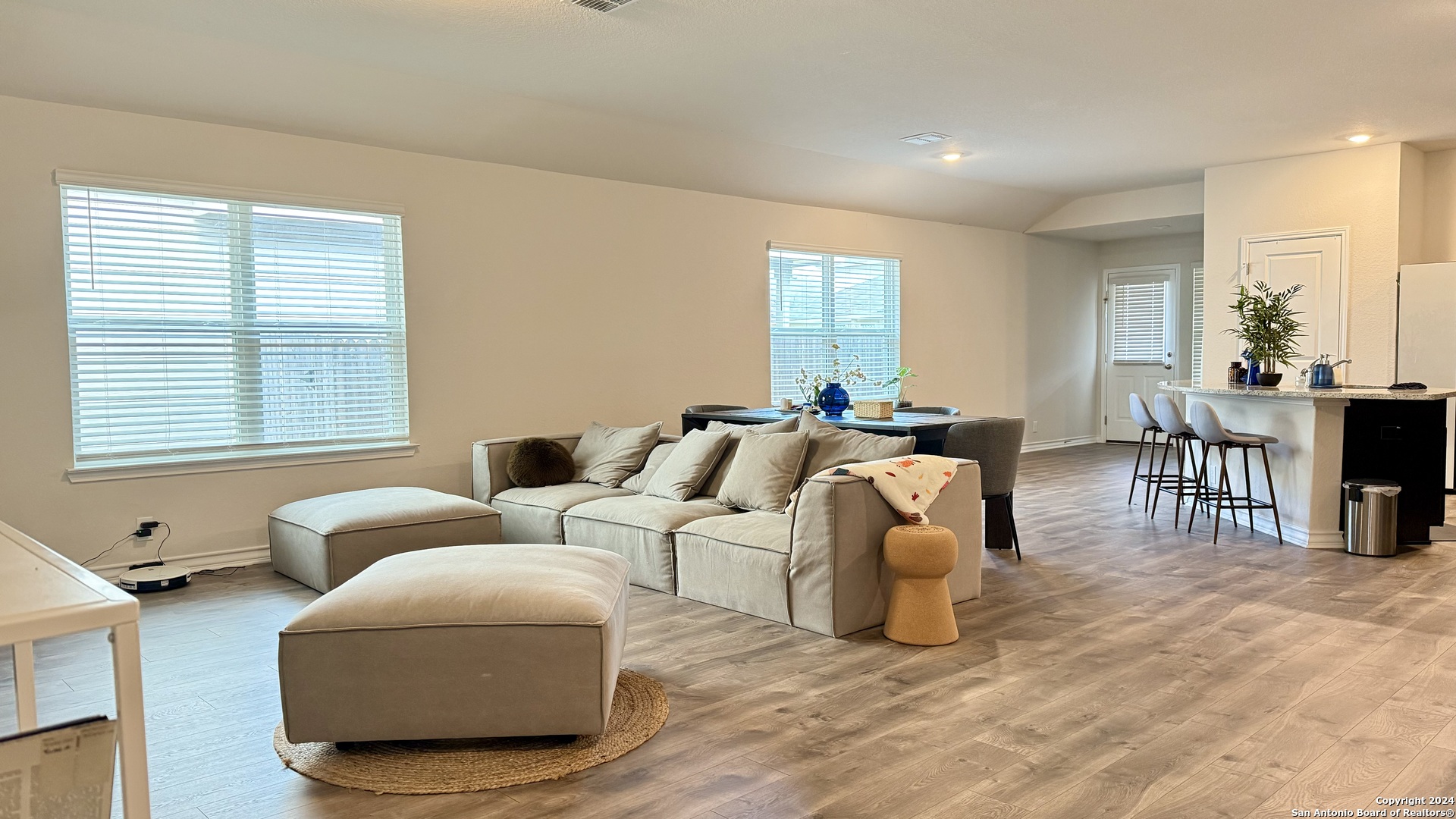 13535 Boothe Grove San Antonio, TX 78254 - Photo 3 of 7 a living room with furniture a dining table and a window