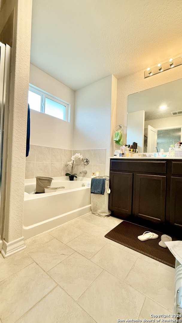13535 Boothe Grove San Antonio, TX 78254 - Photo 7 of 7 a bathroom with a bathtub sink and mirror