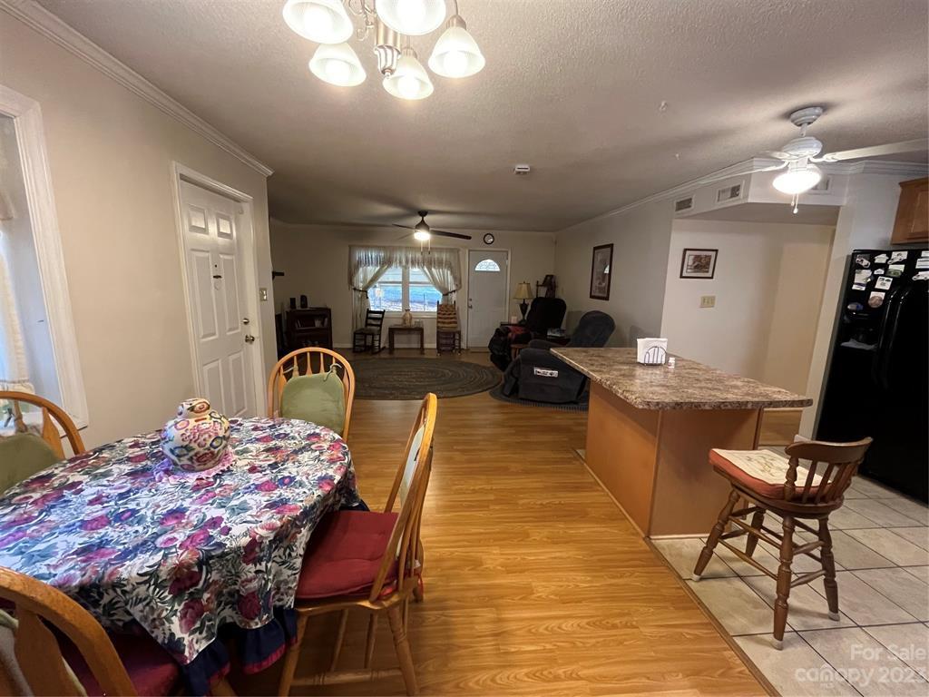 120 Barlow Lane Salisbury, NC 28147 - Photo 16 of 34 a living room with furniture a flat screen tv and kitchen view
