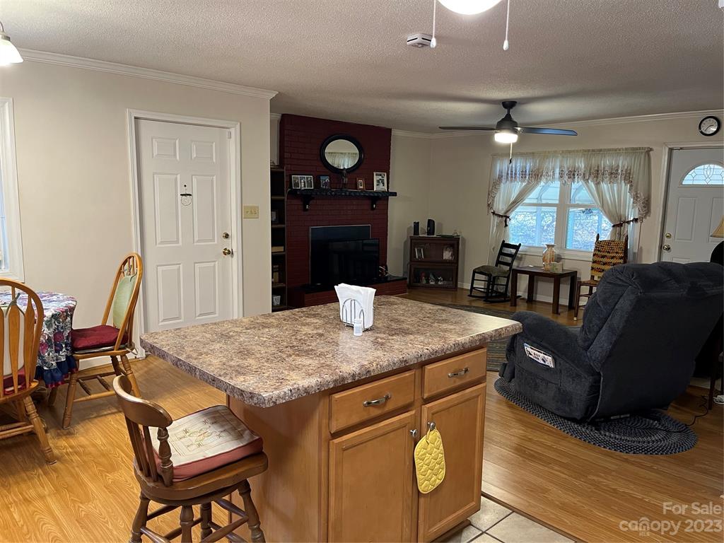 120 Barlow Lane Salisbury, NC 28147 - Photo 18 of 34 a view of kitchen island with stainless steel appliances granite countertop dining table chairs and a refrigerator