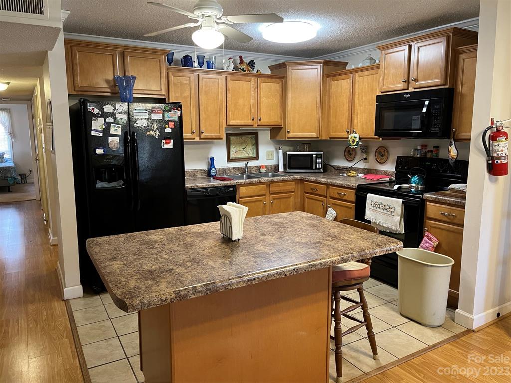 120 Barlow Lane Salisbury, NC 28147 - Photo 22 of 34 a kitchen with stainless steel appliances granite countertop a sink dishwasher and a refrigerator