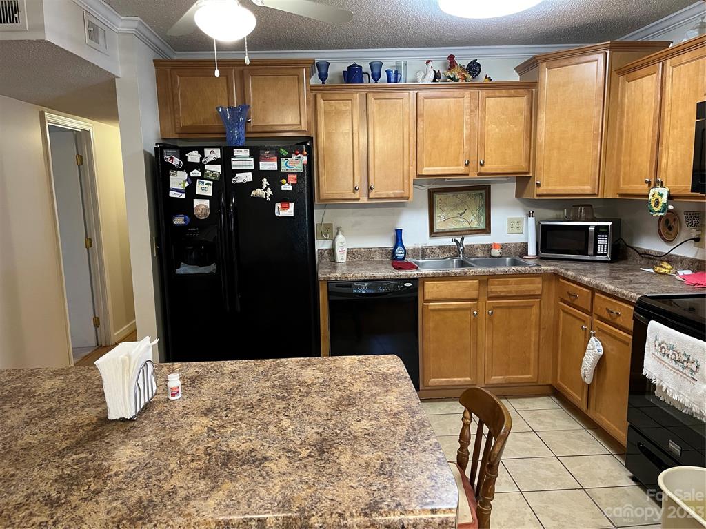 120 Barlow Lane Salisbury, NC 28147 - Photo 23 of 34 a kitchen with stainless steel appliances kitchen island granite countertop a refrigerator and a sink