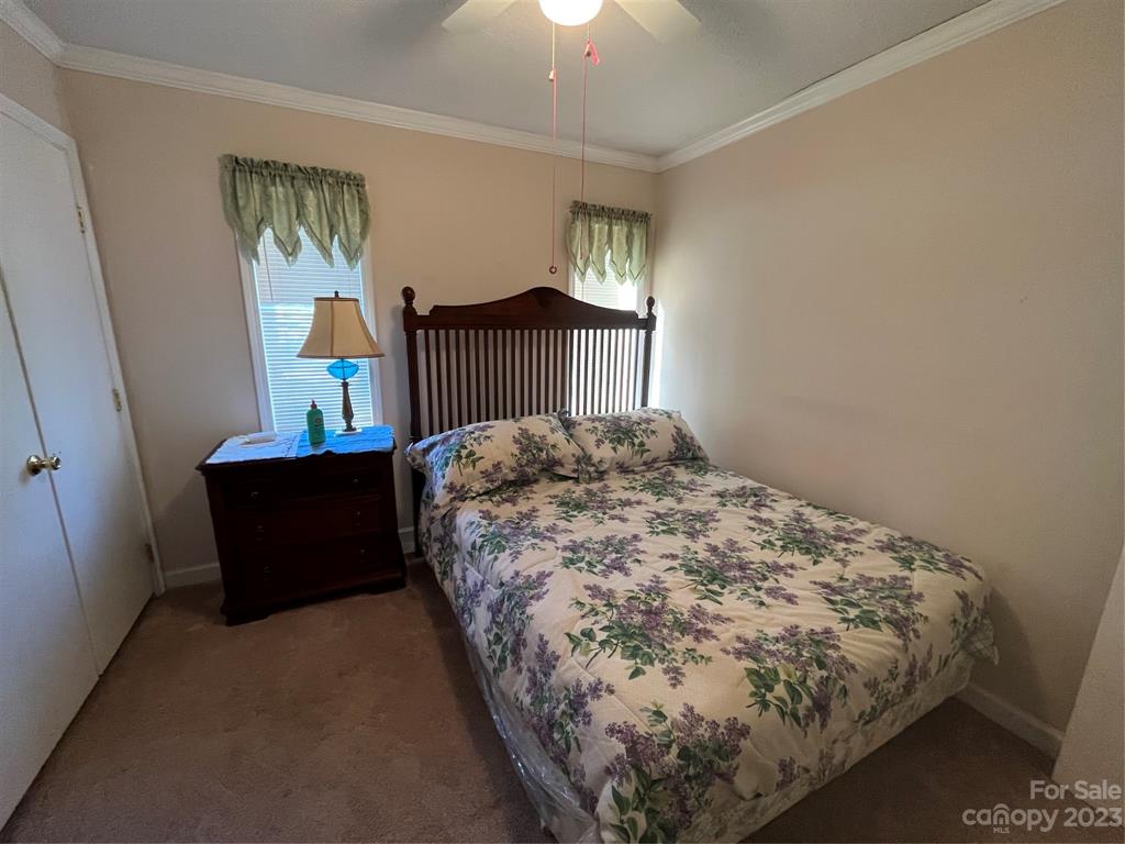 120 Barlow Lane Salisbury, NC 28147 - Photo 29 of 34 a bed sitting in a bedroom next to a window